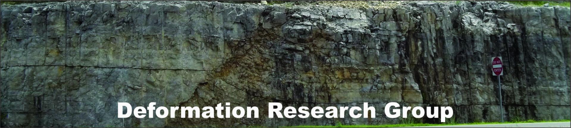 Deformation Research Group text over rock